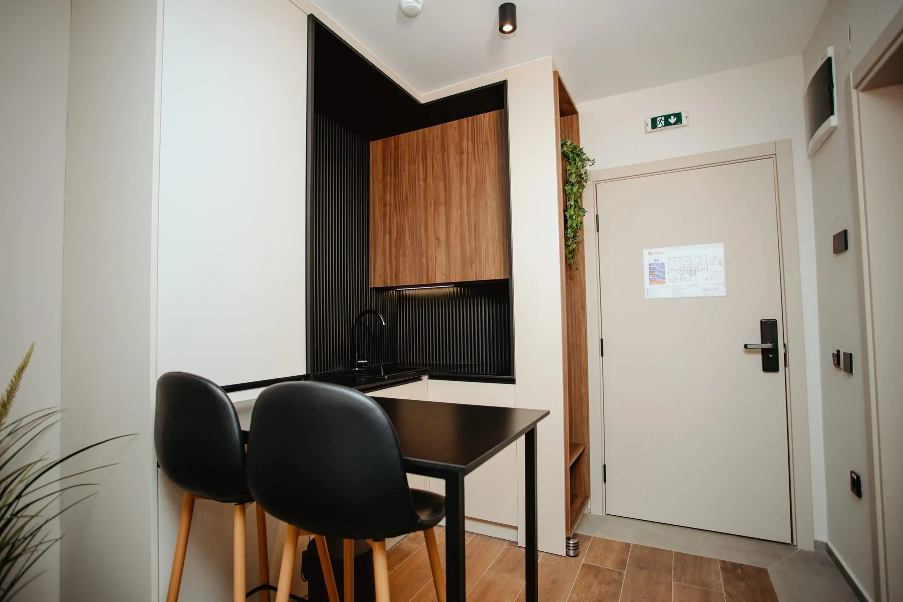 Dining table by the kitchen and the entrance door