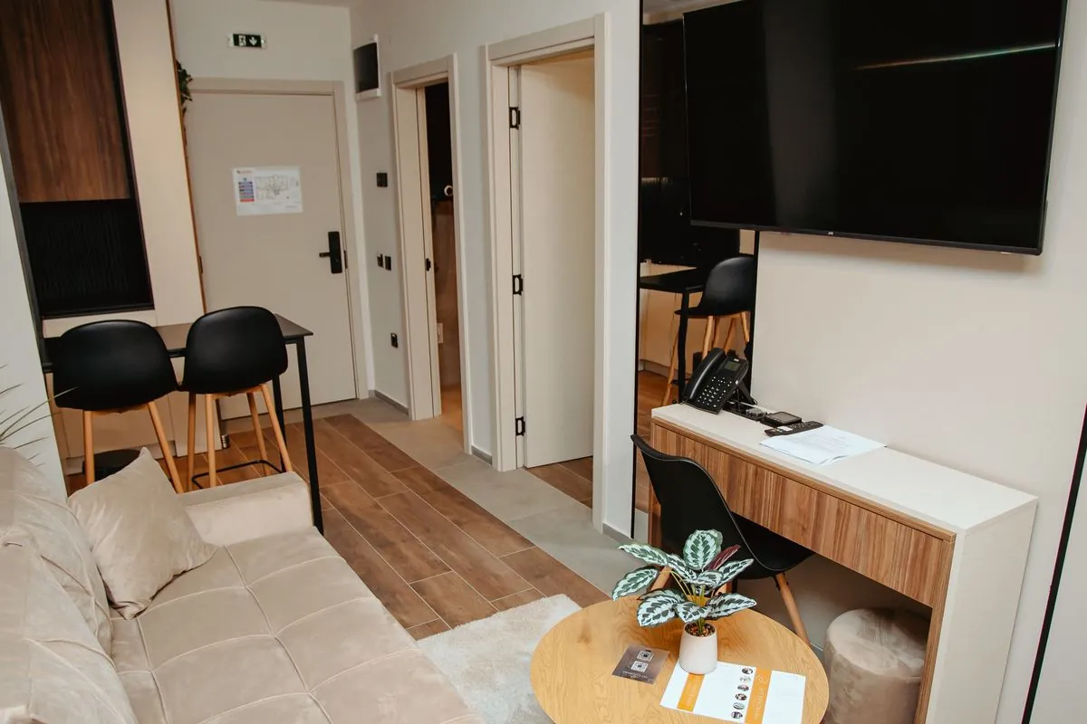 Living room with a TV and work counter