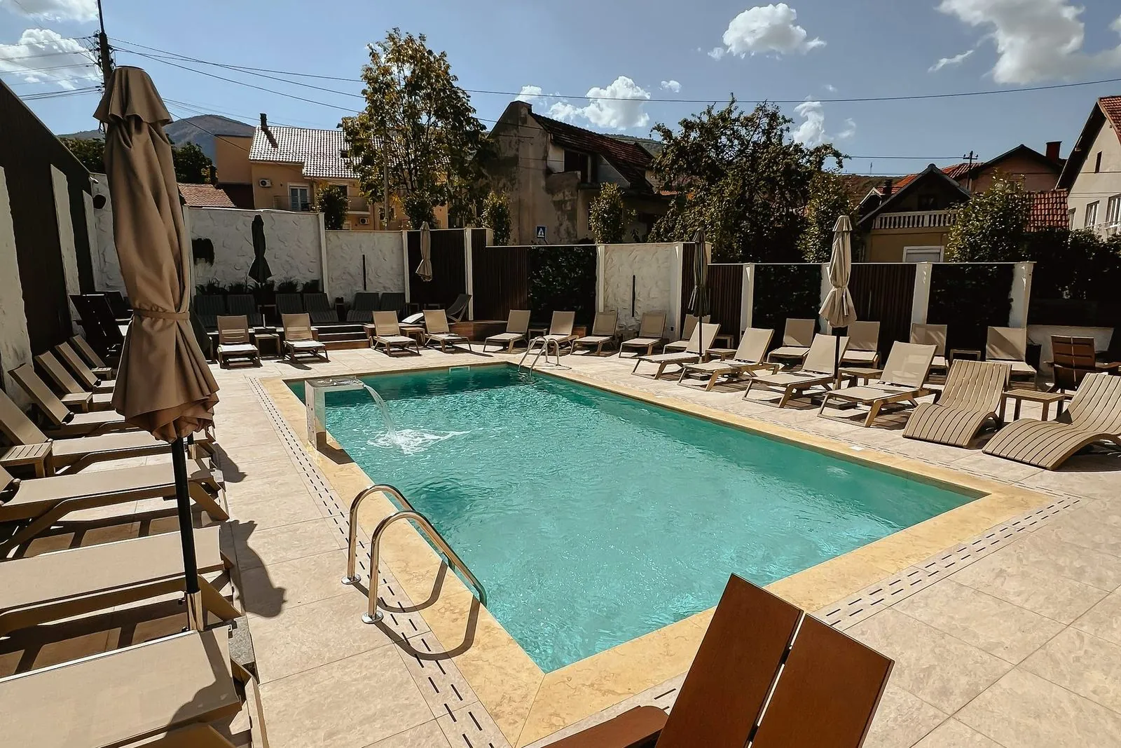 Pool and the wooden courtyard wall