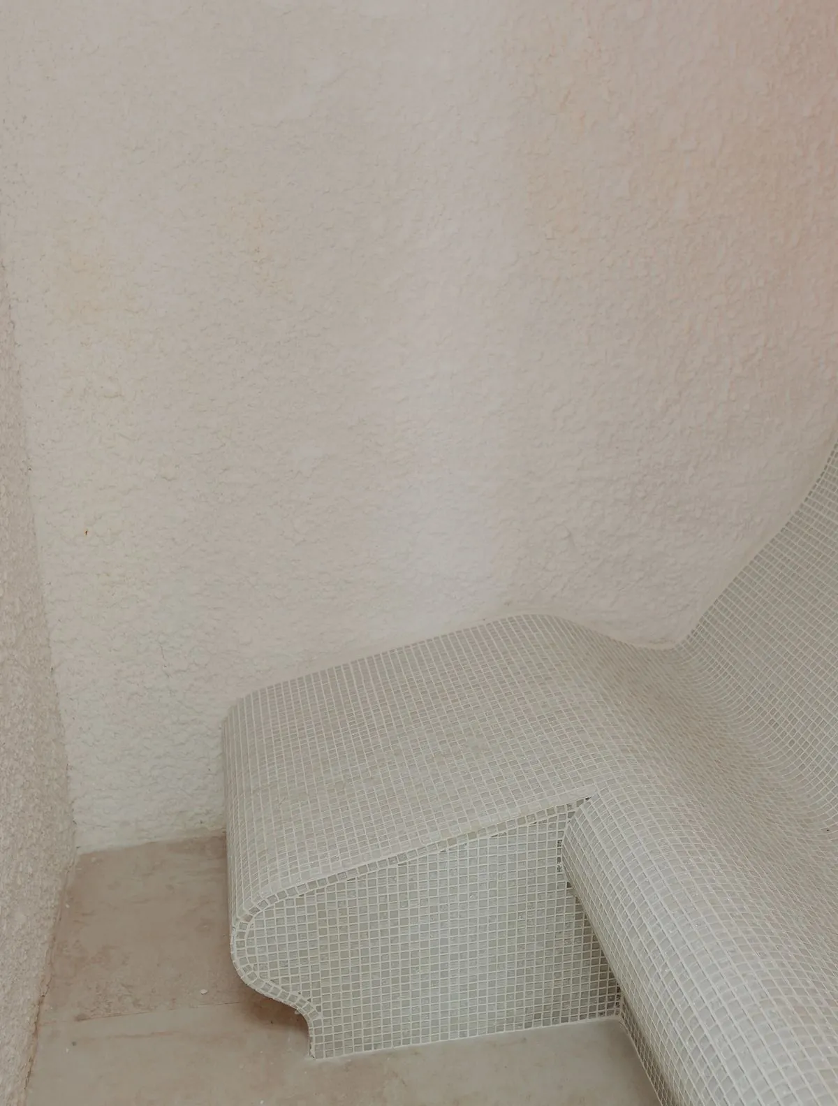Salt room with an illuminated rock-salt wall and a lounger